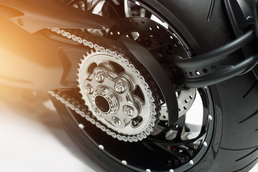 detail of a motorcycle rear chain and gear